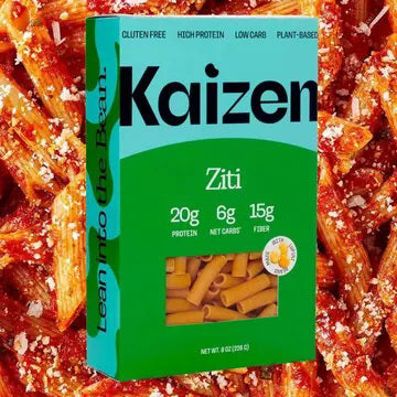 A box of KAIZEN - ZITI PASTA by KAIZEN FOOD COMPANY, gluten free, high protein, low carb, and plant-based, is shown with saucy ziti. The box notes 20g protein, 6g net carbs, and 15g fiber per serving—true high protein pasta!.
