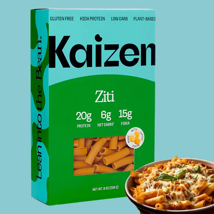 A box of KAIZEN - ZITI PASTA by KAIZEN FOOD COMPANY, gluten free, high protein, low carb, and plant-based, is shown with saucy ziti. The box notes 20g protein, 6g net carbs, and 15g fiber per serving—true high protein pasta!.