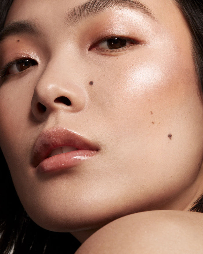 model imagery of killawatt in shades lighting dust and fire crystal on light medium skin tone