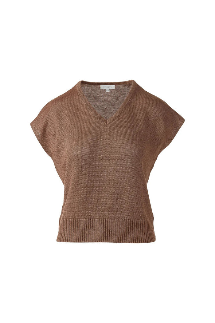 A woman in the KINROSS CASHMERE Cap Sleeve Vee Neck Linen Sweater with blue, brown, and tan stripes and white pants smiles softly against a plain white background.