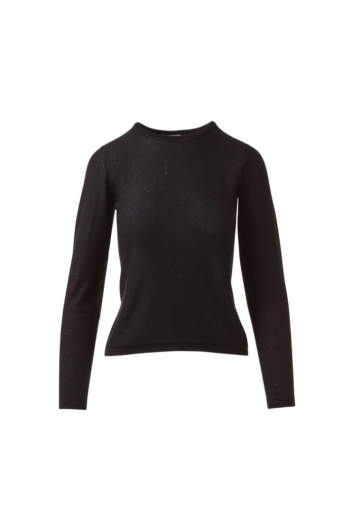 A woman stands facing forward, smiling softly with her hands by her sides, wearing the KINROSS CASHMERE Sequin Crew Neck Sweater in light gray and black pants against a plain white background.