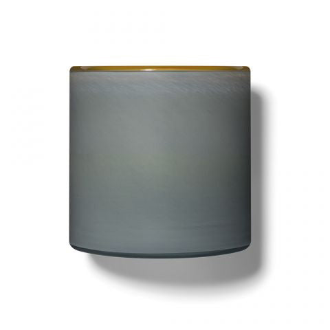 The LAFCO SEA DUNE Beach House 15oz candle is a cylindrical, gray container with a smooth, slightly shiny finish and a thin amber-colored rim, evoking serene beach house decor against a plain white background.