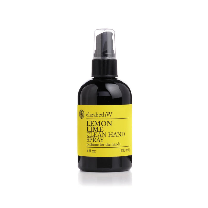 A black spray bottle of E WIGHTMAN & CO LEMON LIME HAND SPRAY 4OZ with a yellow label and clear plastic cap—ideal as a travel-size hand spray for freshening up on the go.