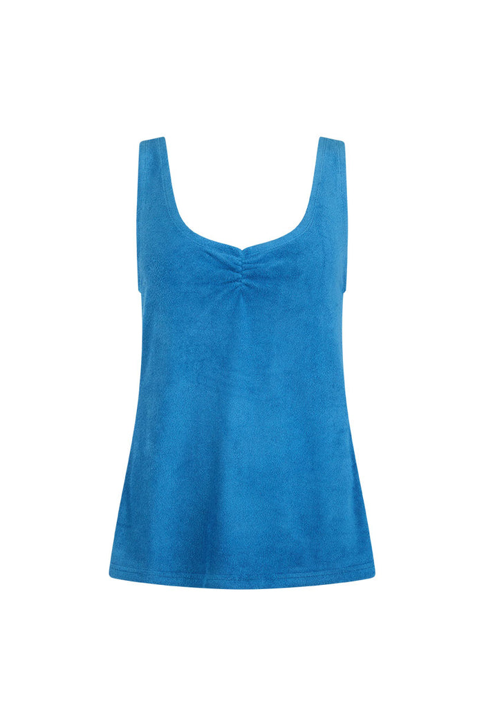 Front flat lay of Azure Blue terry singlet showing ruched bust detail and wide scoop neckline on white background