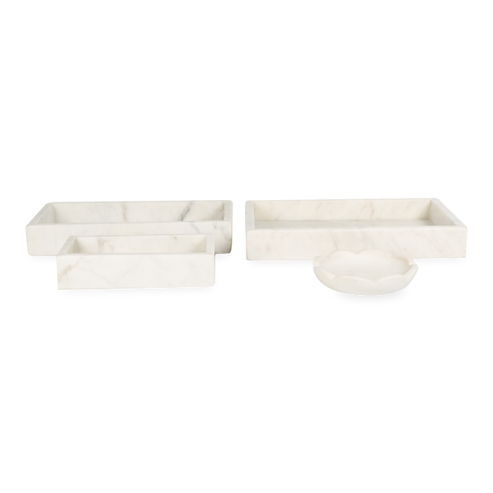 A collection of solid marble countertop pieces with a matte finish.