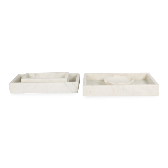 A collection of solid marble countertop pieces with a matte finish.
