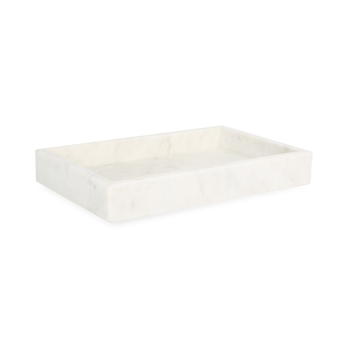 A collection of solid marble countertop pieces with a matte finish.