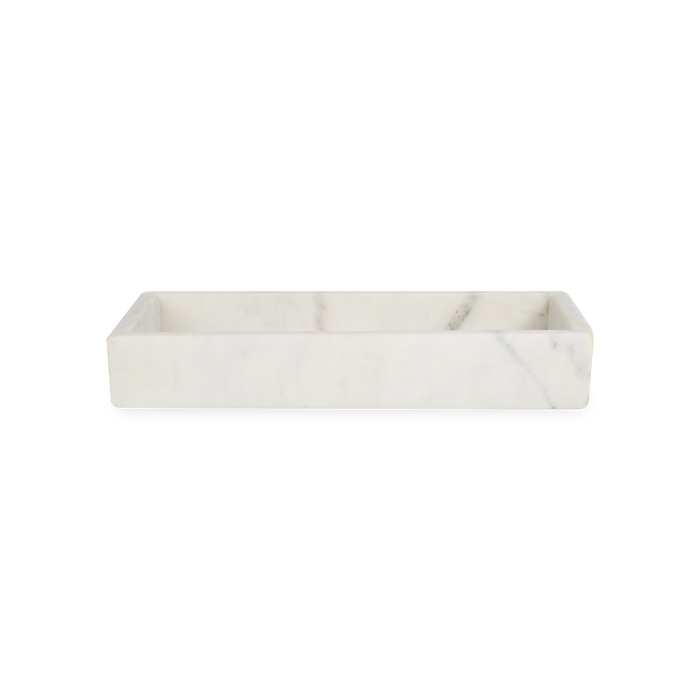 A collection of solid marble countertop pieces with a matte finish.