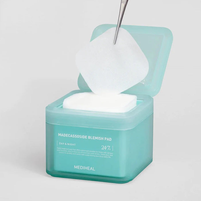 A teal container of "Mediheal - Blemish Pads 100pc" from Exod International, infused with Centella Asiatica for day and night use, highlights its purpose as a daily treatment to provide "24/7" care and address skin issues caused by environmental stress.