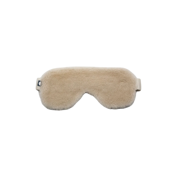 Merino Fleece Sleep Mask in sand beige with soft merino-blend fleece, contoured eye coverage and an adjustable strap for a comfortable, secure fit.