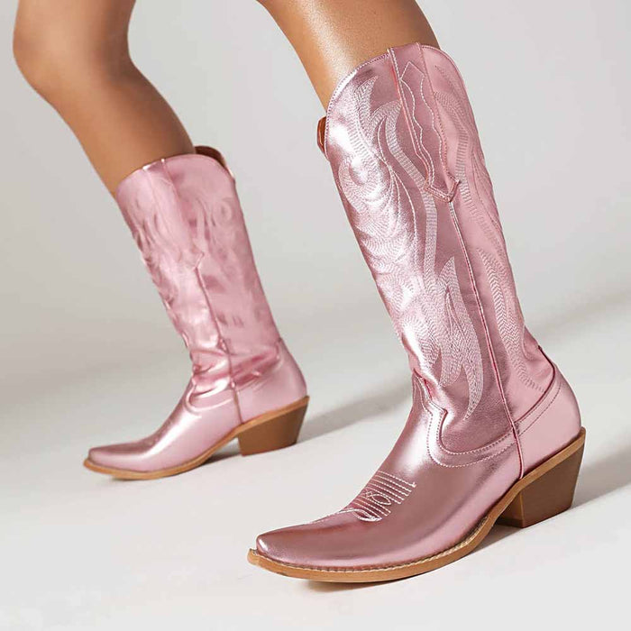 Stylish metallic cowboy boots for women in shiny pink with decorative stitching and stacked heel