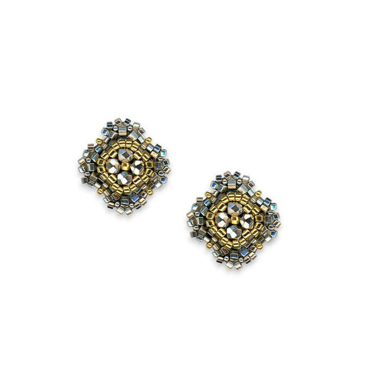 The MIGUEL ASES - PYRITE MIYUKI STUD EARRINGS by MIGUEL ASES, INC. feature square handcrafted studs with gold, silver, and pyrite beads in an intricate geometric pattern on a white background.