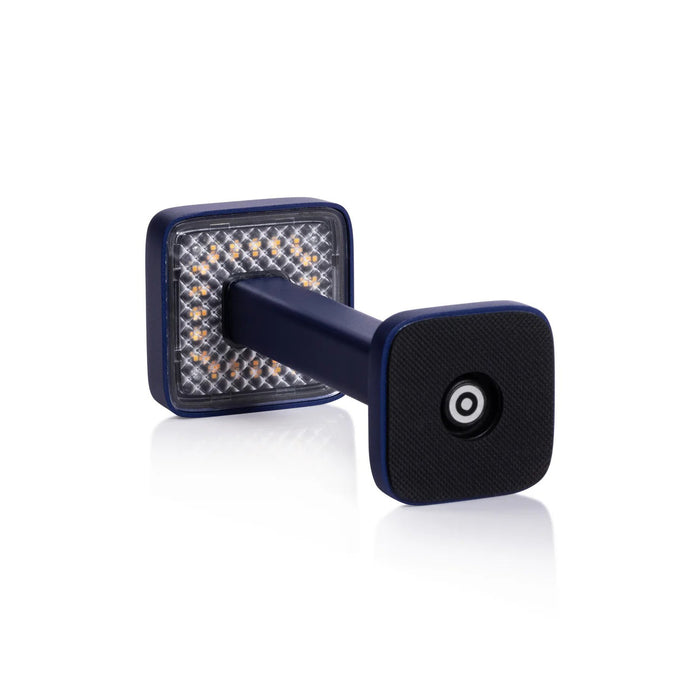 The ZODAX MONZA RECHARGEABLE TABLE LIGHT is a black, rectangular, pedestal-shaped device with a square touchpad on top, offering USB rechargeable capability and adjustable light intensity, shown upright on a white background.