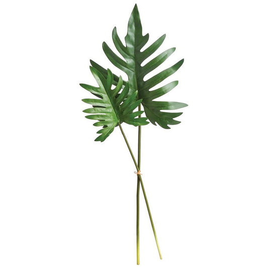 The NAPA HOME AND GARDEN - SPLIT LEAF SELLOUM STEM LARGE features two tropical green leaves with long stems, offering a glossy texture akin to realistic philodendrons. Ideal for home decor, these artificial leaves are displayed against a white background for an authentic look.