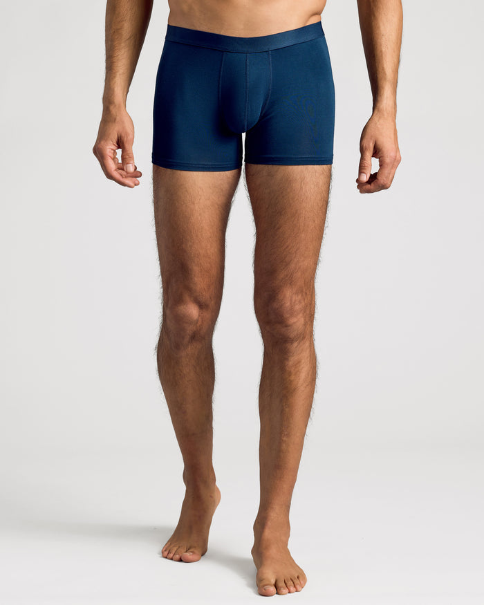 Man wearing Navy Boxer Trunks from 3-Pack, displaying fit and waistband.