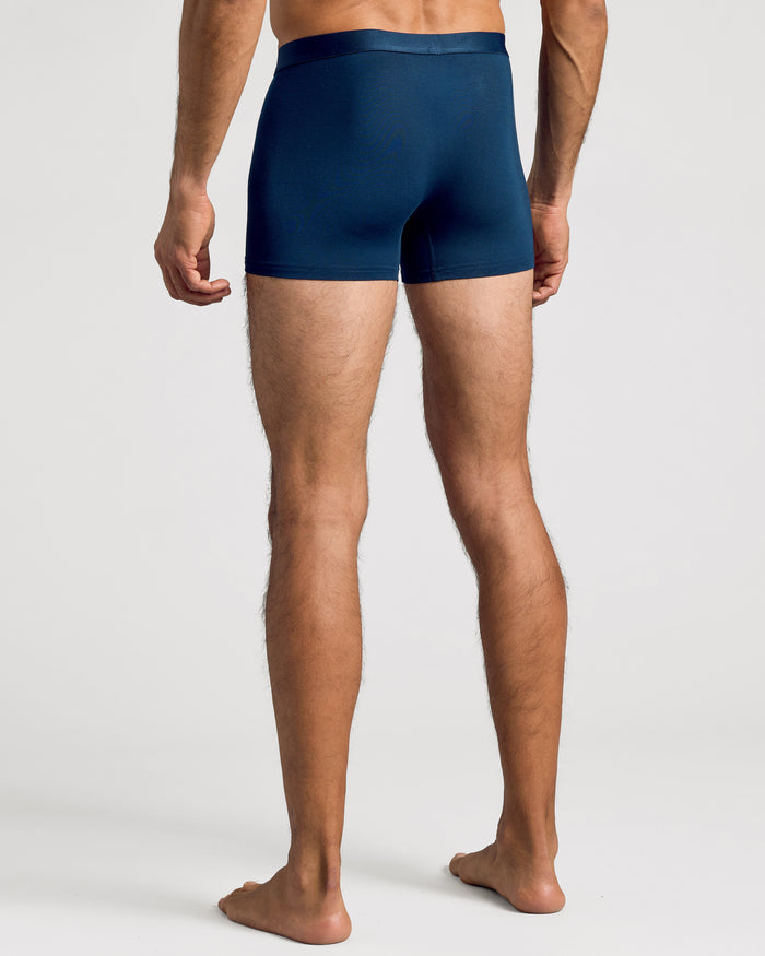 Man wearing Navy Boxer Trunks 3-Pack, showcasing snug fit and comfort.