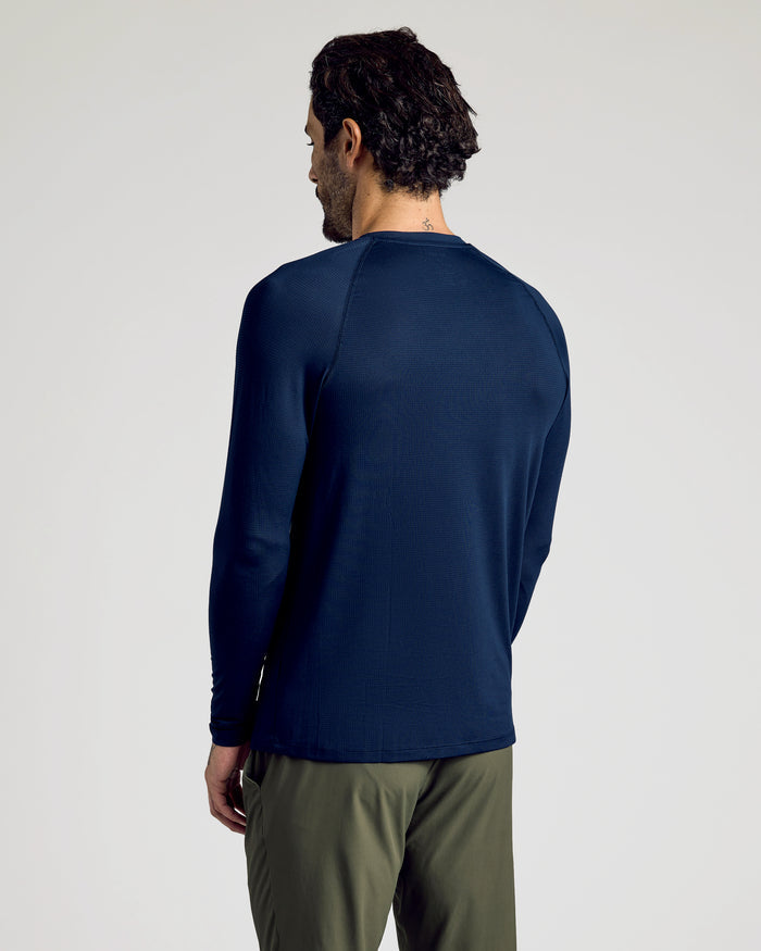 Man wearing Navy Long Sleeve Active Mesh Crew, showcasing back view.