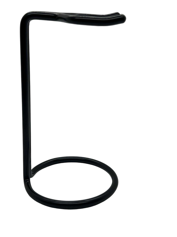 Black metal stand for drying shaving brushes in grooming