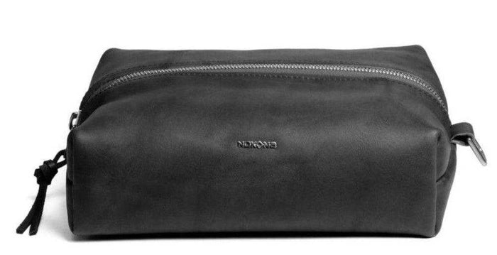 Black leather toiletry bag with zipper closure for toiletries