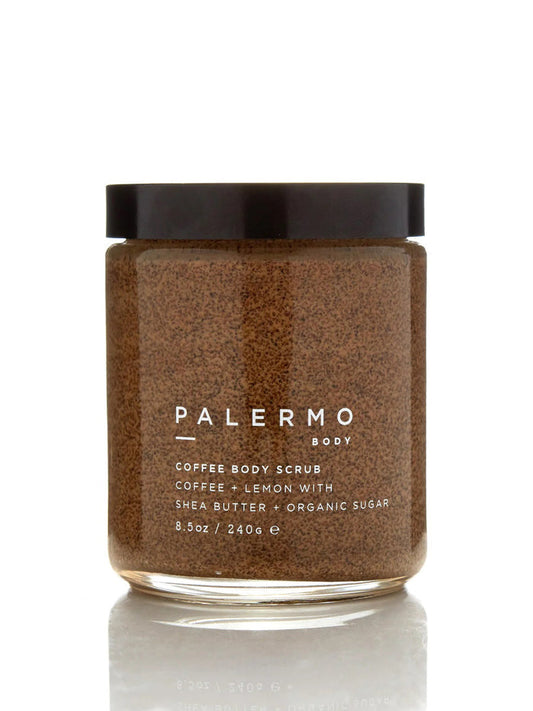 A clear jar with a black lid holds PALERMO BODY’s COFFEE & LEMON BODY SCRUB, an exfoliating sugar scrub with shea butter and organic sugar (8.5oz/240g). The brown, granular formula is a favorite for cellulite treatment.