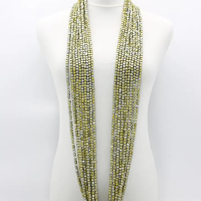 A mannequin displays the JIANHUI LONDON PASHMINA NECKLACE HAND PAINTED 10 STRAND, featuring vibrant, hand-painted wooden beads cascading elegantly around the neck.