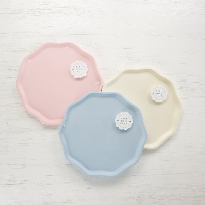 Three pastel-colored plates on a light gray background.