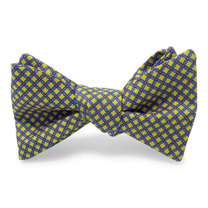 The BIRD DOG BAY PETER-BLAIR Cushions Silk Bow Tie in yellow features a blue checkered pattern, handmade design, adjustable neck sizing for a perfect fit, and is displayed against a white background.