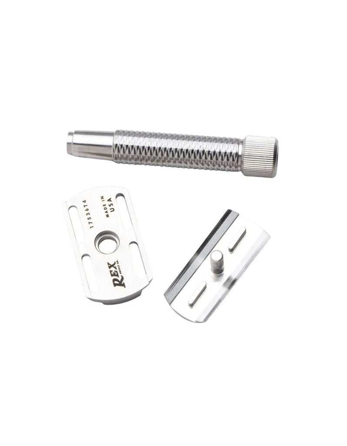 Disassembled stainless steel safety razor components including handle, base plate, and blade holder, for assembly and maintenance.