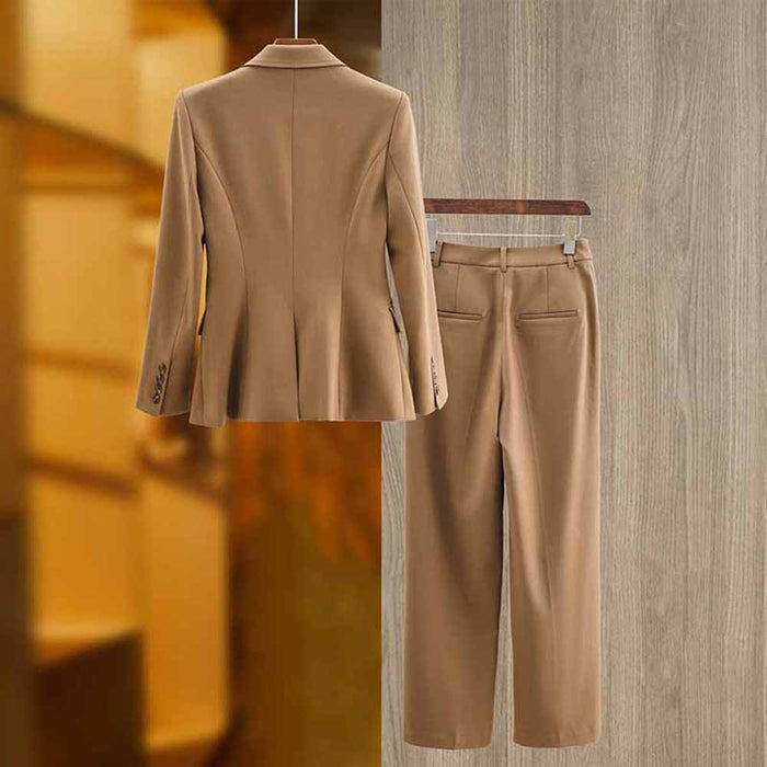 Stylish women's white pantsuit set featuring a tailored blazer and matching trousers.