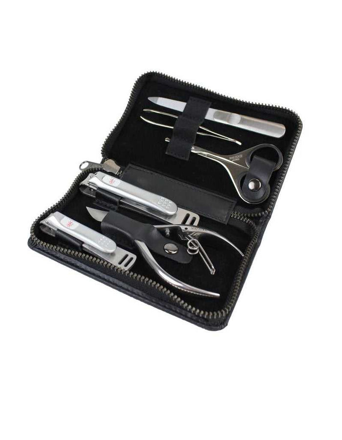 Luxury manicure grooming kit with nail scissors, tweezers, and clippers in black case