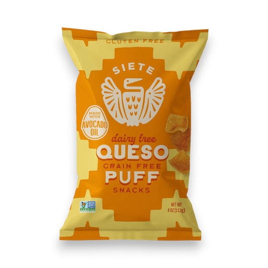A 4 oz bag of Siete Foods Queso Grain Free Puff Snacks. The packaging is mainly yellow with orange accents, featuring a logo with an eagle and the brand name "Siete." It is labeled dairy-free, grain-free, and made with avocado oil.