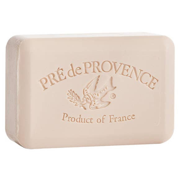 A rectangular beige coconut bar soap (250g) by EUROPEAN SOAPS, LLC, French-milled and embossed with "PRÉ de PROVENCE," a bird with a branch, and "Product of France" on the front.
