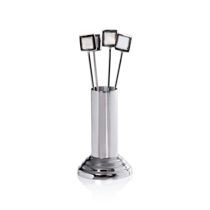 The ZODAX SPIGA Set of 4 Cocktail Picks with Stand features sleek metal picks with square mother of pearl tops in a metallic holder with round base. Ideal for stylish home bars. Set photographed on a plain white background.