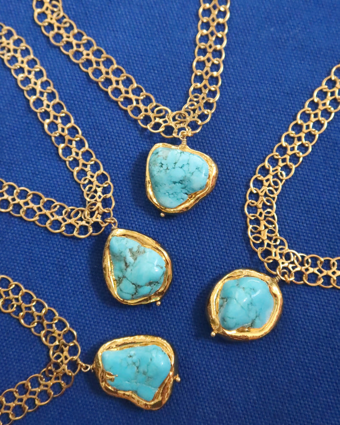 Gold necklaces with turquoise stone pendants made in Greece, Greek jewelry