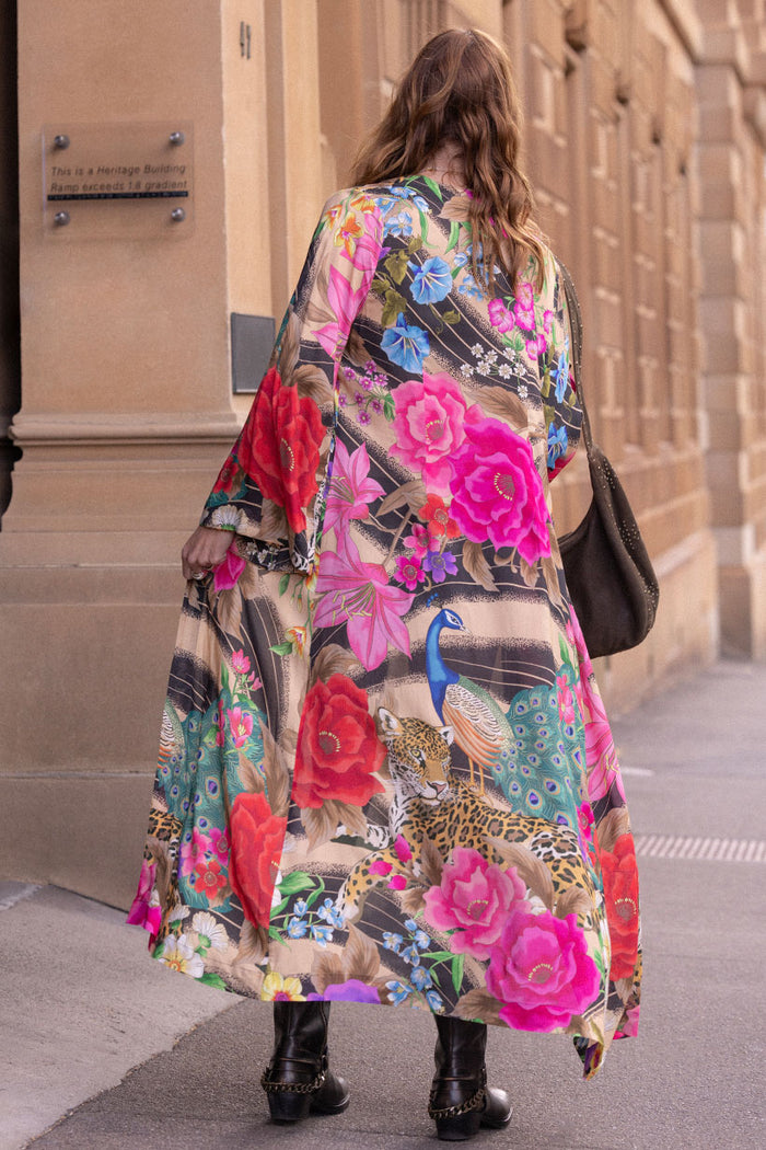 Back view of Valley of the Dolls Duster in Jewel, showing allover floral and peacock print on ECOVERO viscose
