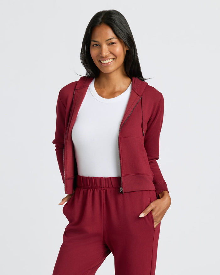 Womens Dark Maroon Crop Zip Hoodie & Relaxed Jogger 2-Pack worn by smiling woman.