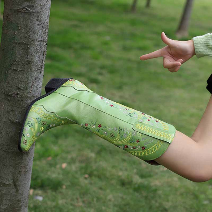Stylish women's knee length cowgirl boots in green with decorative embroidery, perfect for casual outings