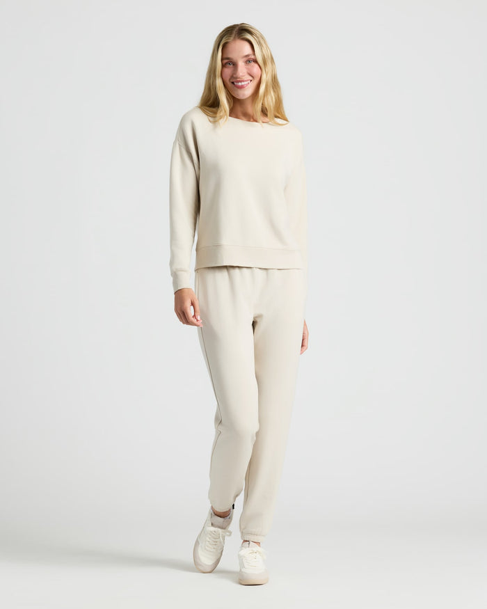 Woman models Womens Oatmeal Slouch Pullover Crew & Relaxed Jogger 2-Pack. MODEL_INFO: Cora is 5'10", wearing a size S