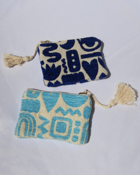 Two patterned pouches  in dark blue and turquoise blue with tassels handmade in Greece