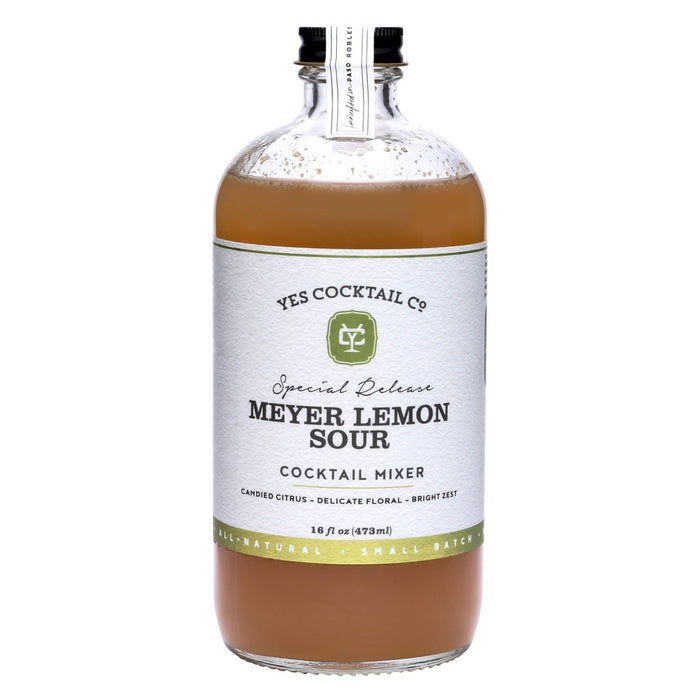 A dark brown glass bottle with a black label displaying the words "Meyer Lemon Sour" in large white letters. Below, smaller text describes it as "Tart, Floral, Rich," perfect for enhancing cocktails. The bottle has a white seal on the cap from YES COCKTAIL CO., indicating it hasn't been opened yet.