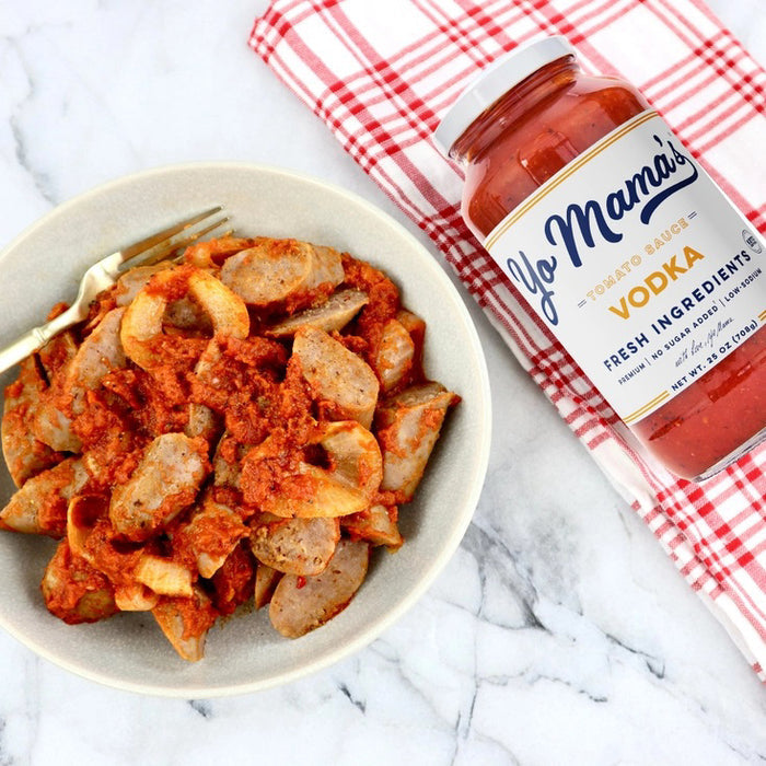 A 25 oz (708g) jar of YO MAMA'S - VODKA SAUCE by YO MAMA'S FOODS, featuring a white label and red lid. Highlights: fresh ingredients, keto certified, no sugar added, all-natural, and gluten-free.