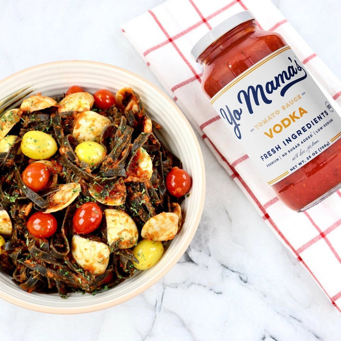 A 25 oz (708g) jar of YO MAMA'S - VODKA SAUCE by YO MAMA'S FOODS, featuring a white label and red lid. Highlights: fresh ingredients, keto certified, no sugar added, all-natural, and gluten-free.